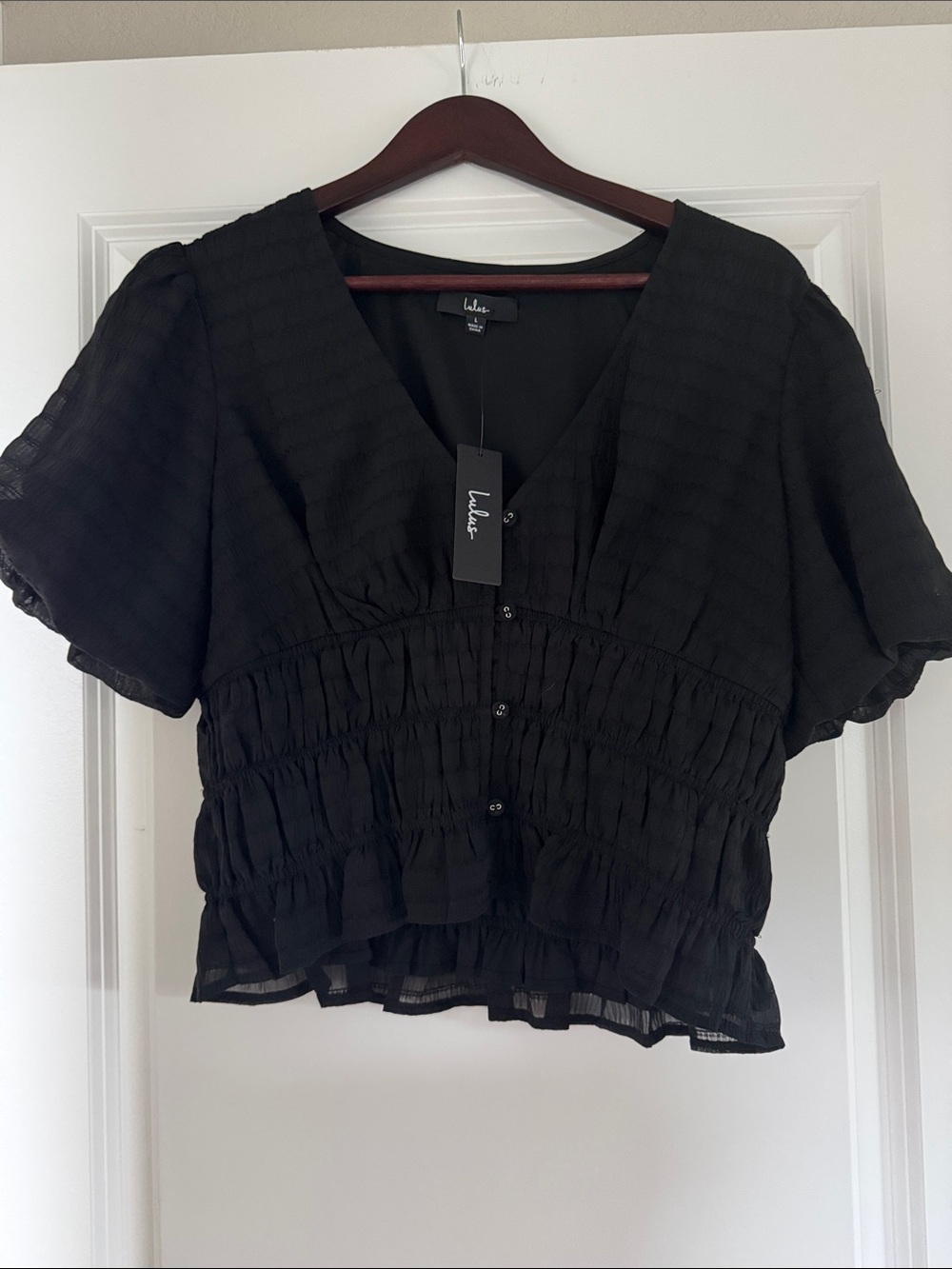 Lulu's Black Textured Button-Front V-Neck Peplum Top